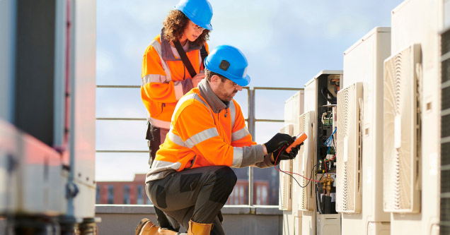 Image showing Engineers testing an electrical connection